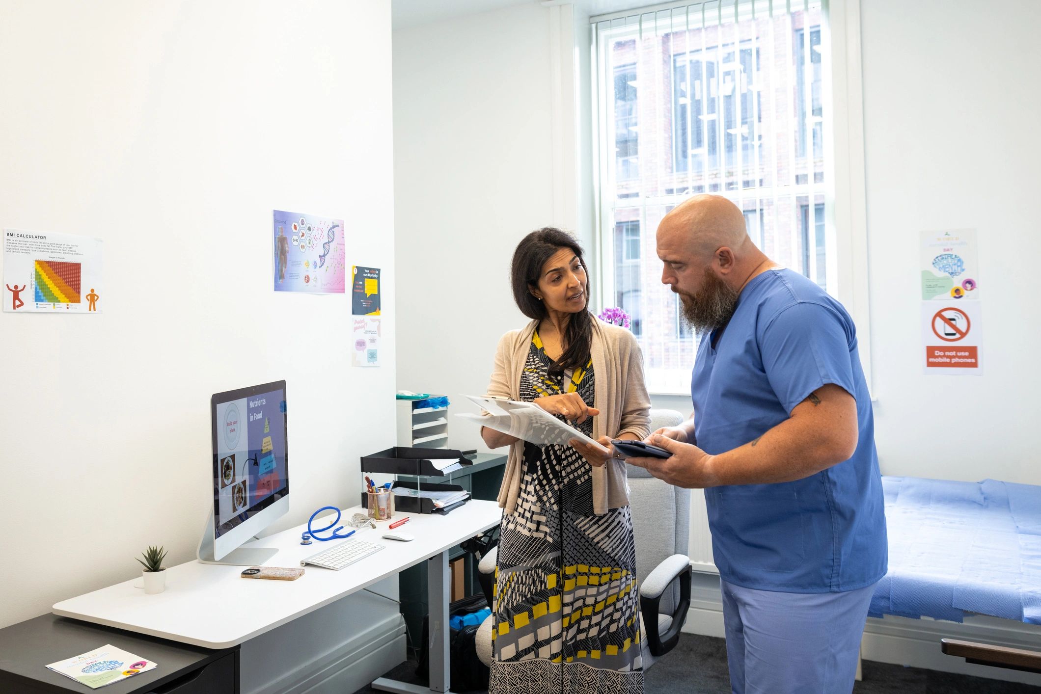Healthcare professionals reviewing patient information